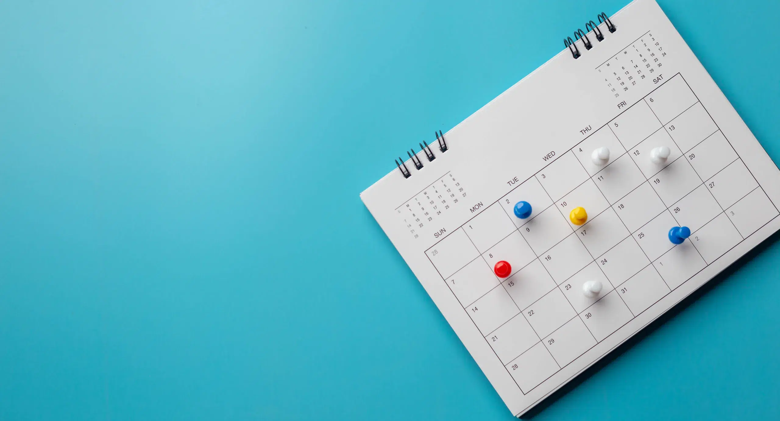 Calendar,On,Solid,?blue,Background,With,Copy,Space,,Pinned,In